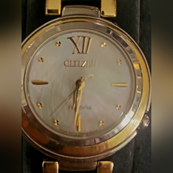 Citizens women's Eco-Drive watch with a pearl face and gold trim and a gold hand - Picture 3 of 13